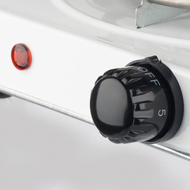 Black knob labeled 'OFF' on a white vehicle