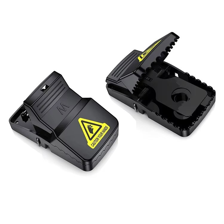 Black mouse trap with a yellow warning label on a white background