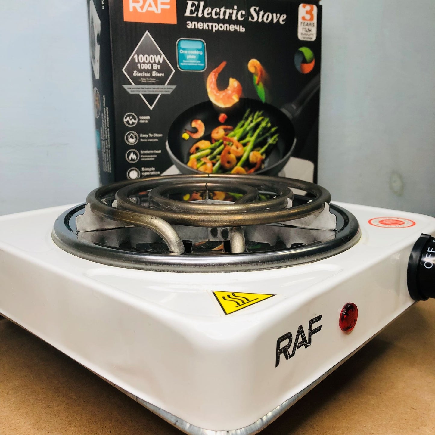 RAF electric stove with packaging in the background