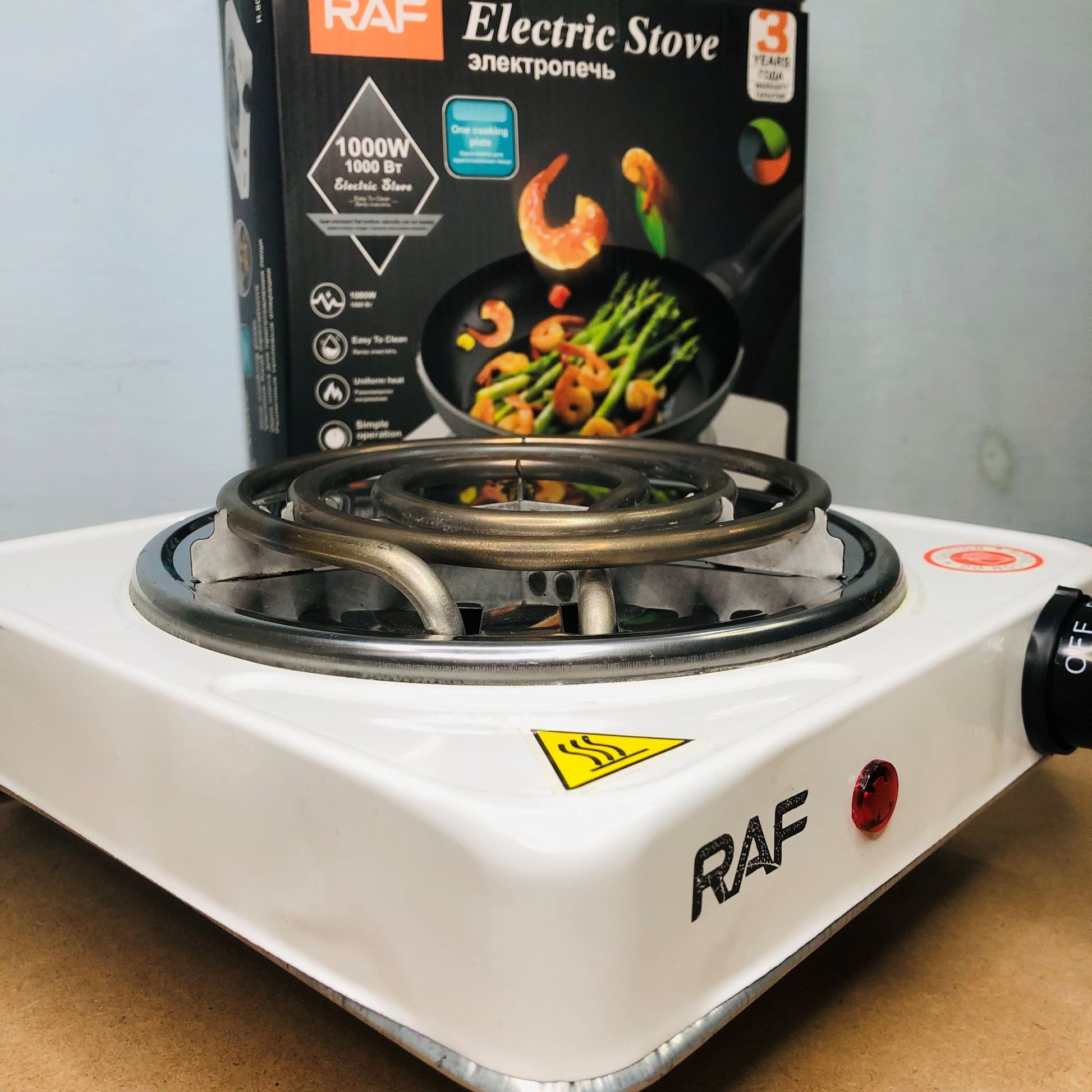 RAF electric stove with packaging in the background